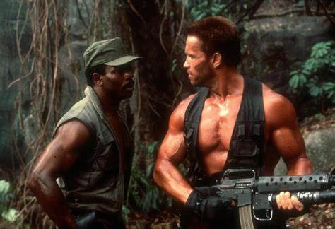 Predator - Carl Weathers as Dillon, and Arnold Schwarzenegger as Dutch