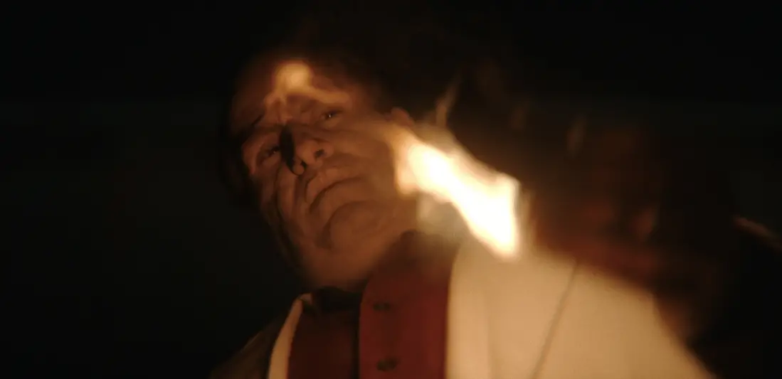 Colin Farrell as Oz Cobb holding a lighter in the HBO series The Penguin